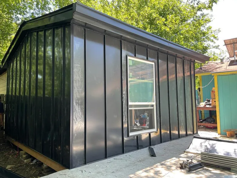 Black standing seam metal wall panels for Roof Inspection in Bluffdale