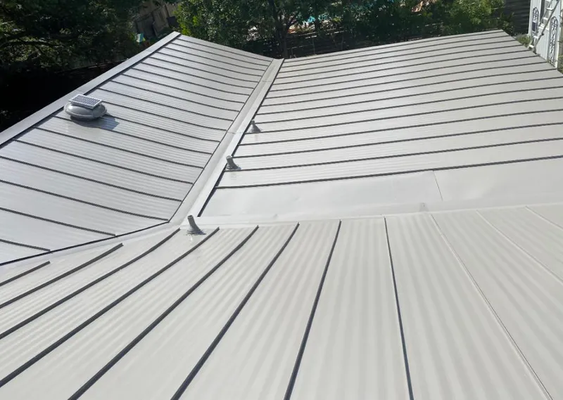 Solar attic fan installed on a metal roof for Roof Ventilation in Bluffdale